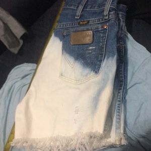 Bleached out wrangler cut offs.